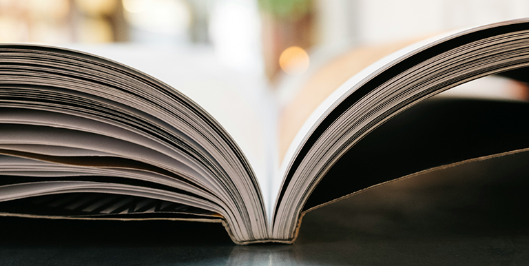 Open printed book on a table