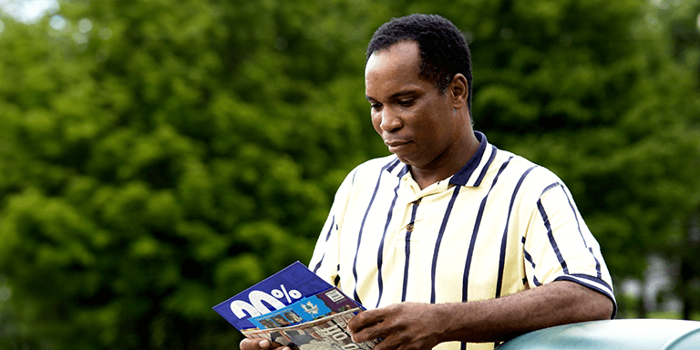A Man looking at Direct Mail 