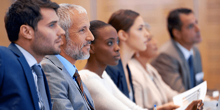 A group of people in a meeting