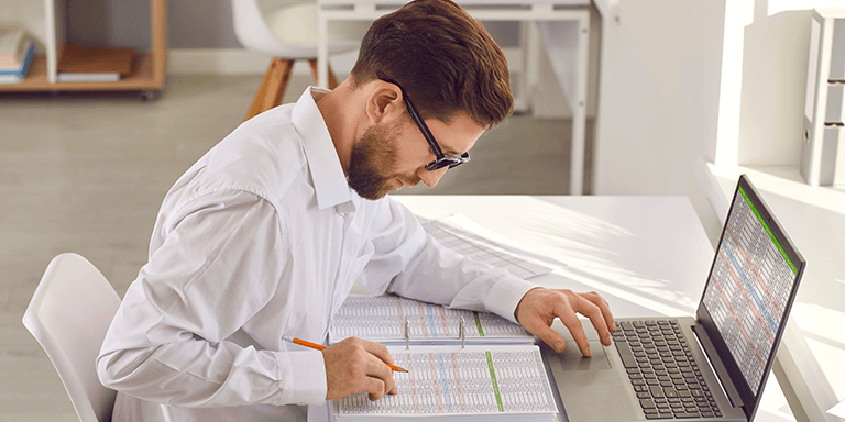 Person looking at project pricing sheets